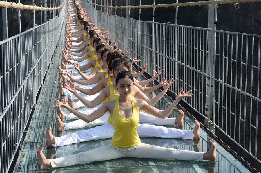 Yoga in the air on suspended bridge