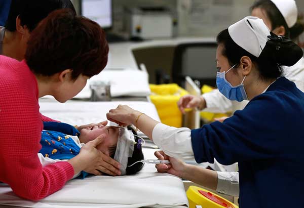 Thousands of kids fall ill with the flu in Beijing