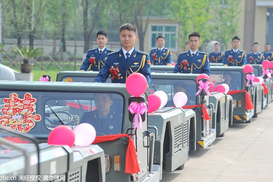 Military-style wedding: Fighter jets, grooms in dashing uniforms