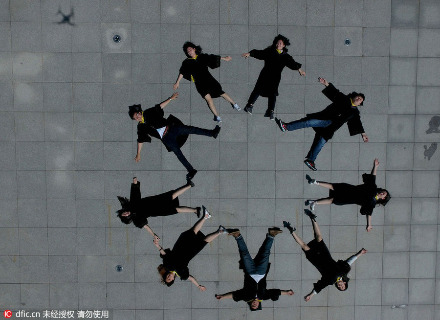 Students pose for special group photos to mark graduation