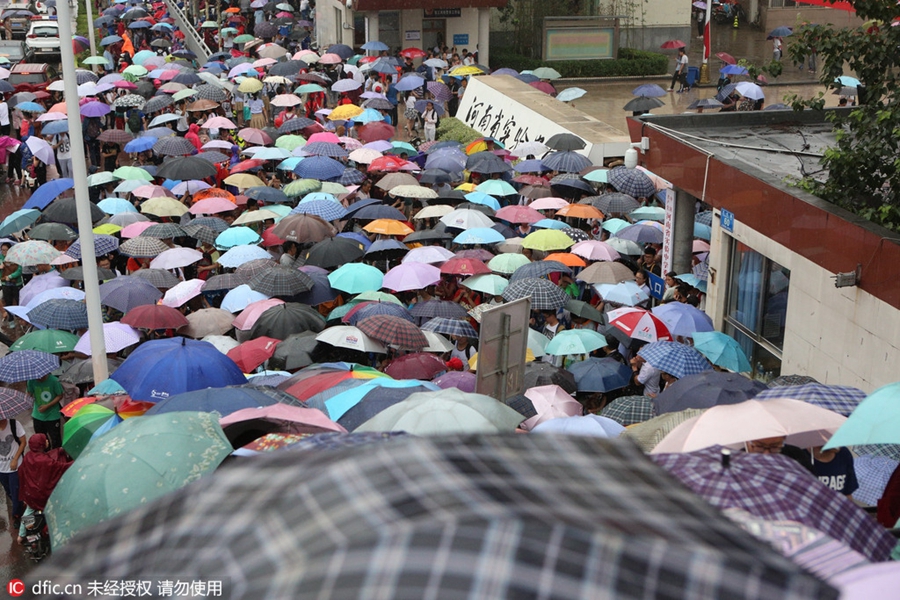 Hugs, anxious parents, high-tech security: China's college entrance exam starts