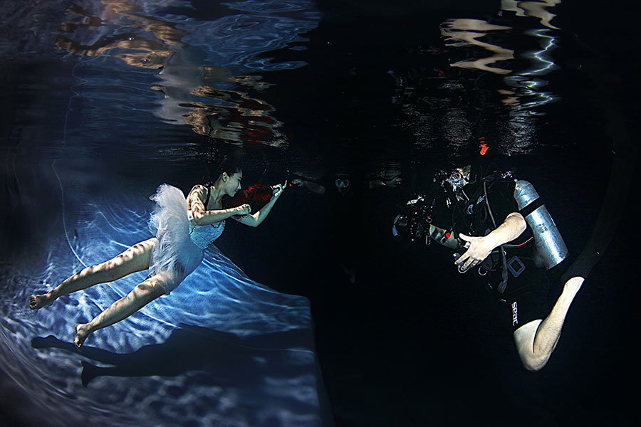 University students go underwater to celebrate graduation