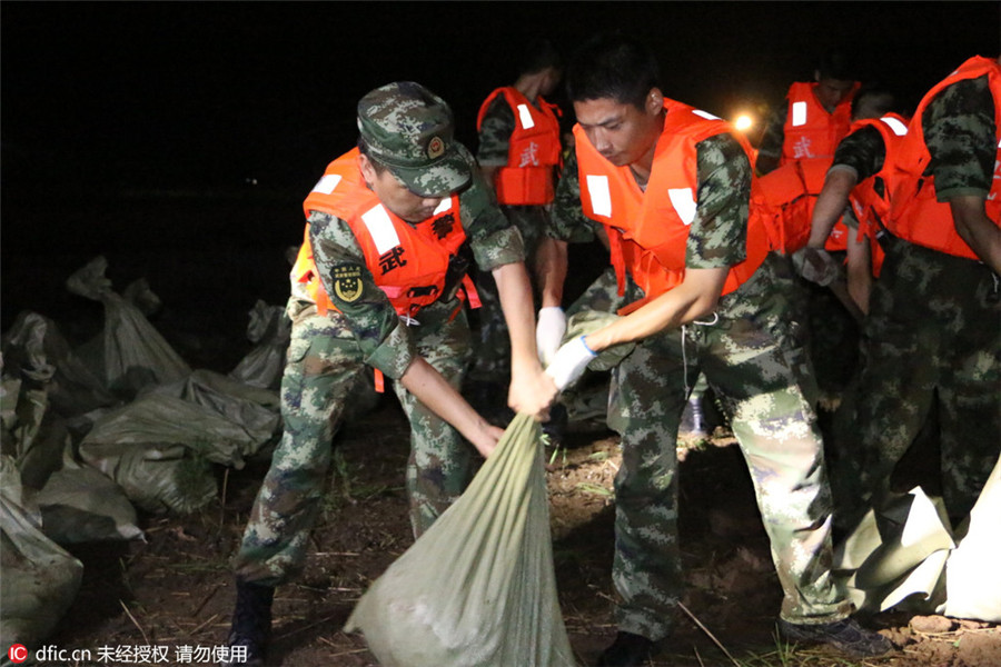 Remember emerging heroes in China's floods