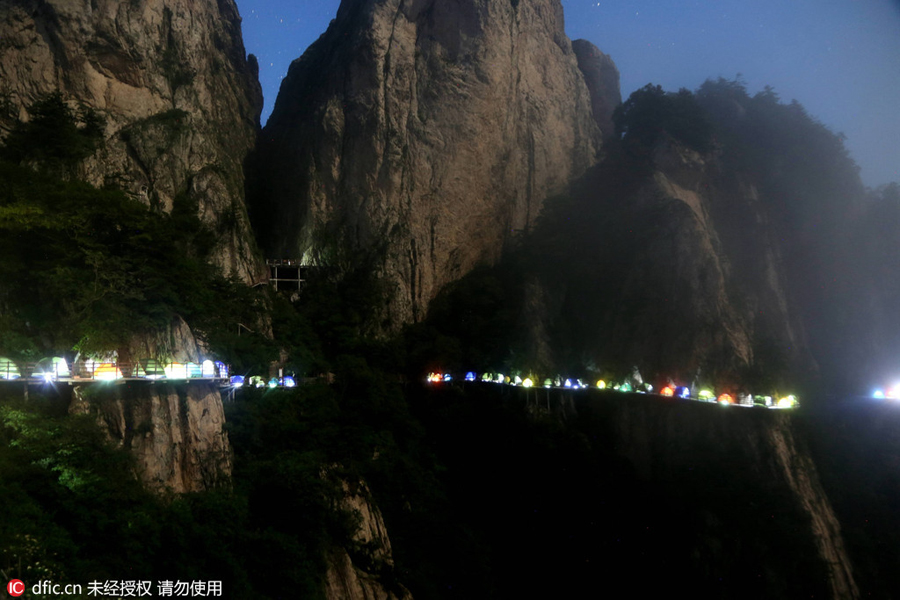 Campers sleep perched on cliff face