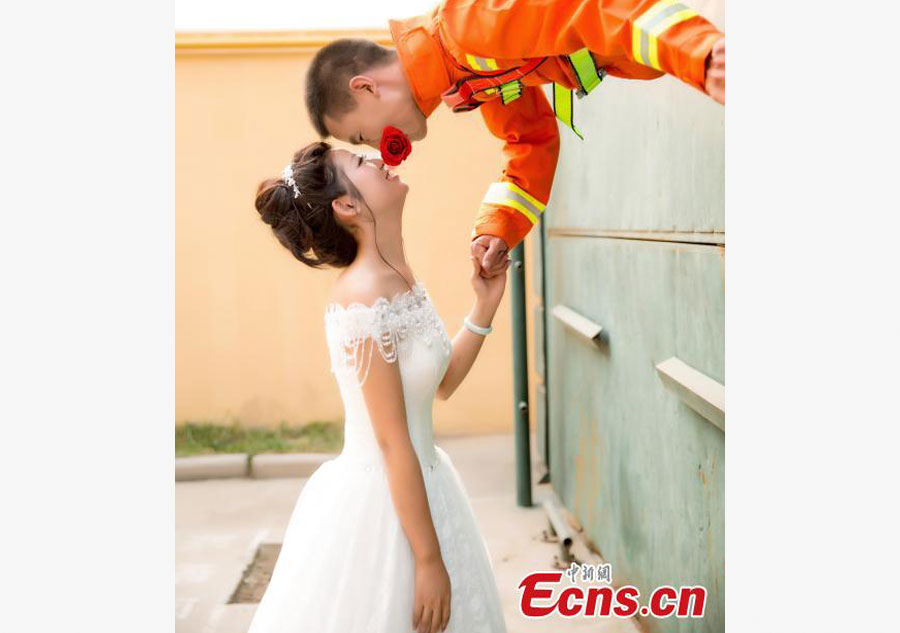 Firefighter poses for unconventional wedding photos
