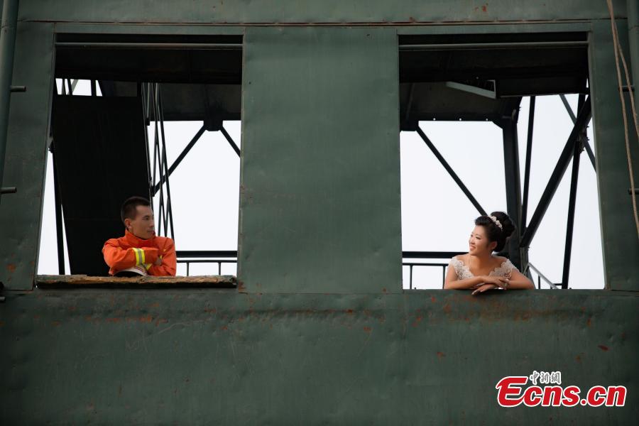 Firefighter poses for unconventional wedding photos