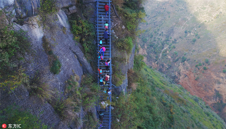 Steel ladder opens safer path for cliff village children