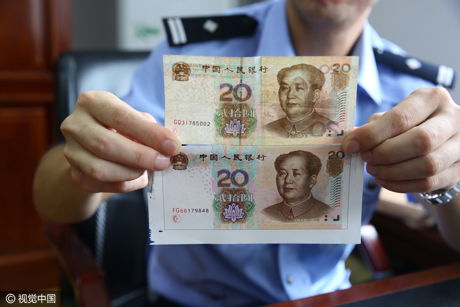 Gang busted for making and selling fake 20-yuan bank notes