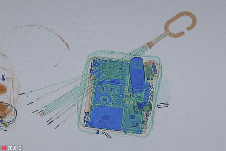 X-ray scanner reveals passangers' luggage for home journey