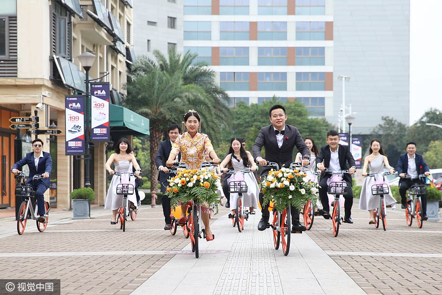 Sharing is caring: Newlyweds take bike-sharing ride