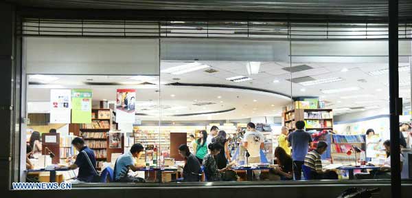 Residents read books at 24-hour bookstore in Beijing