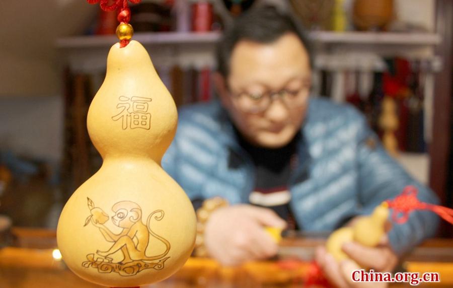 Monkeys on artist's gourd pyrography