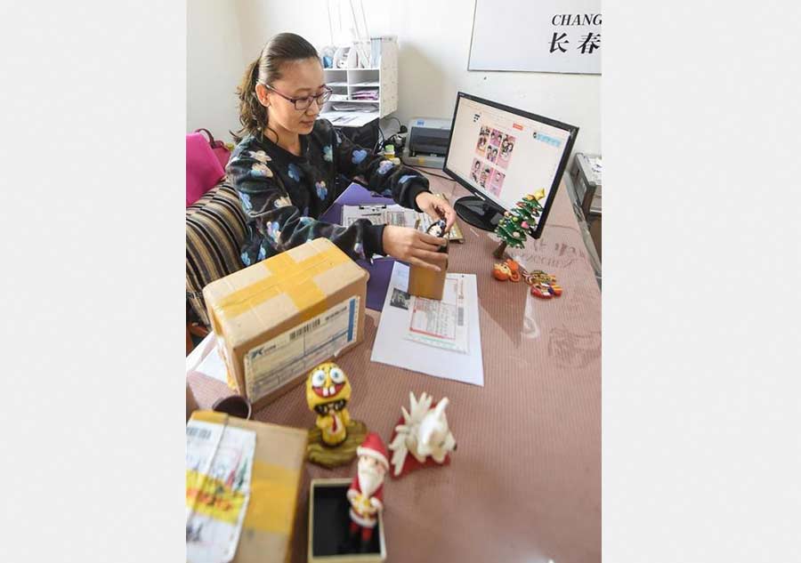 Tailor-made clay dolls presented at studio in Changchun