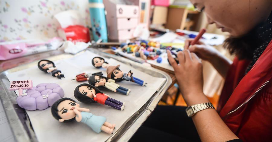 Tailor-made clay dolls presented at studio in Changchun