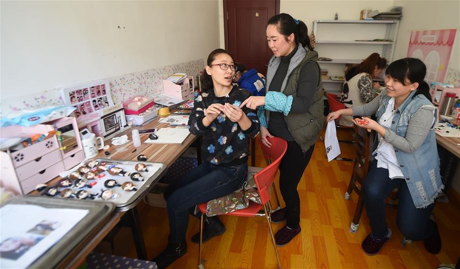 Tailor-made clay dolls presented at studio in Changchun