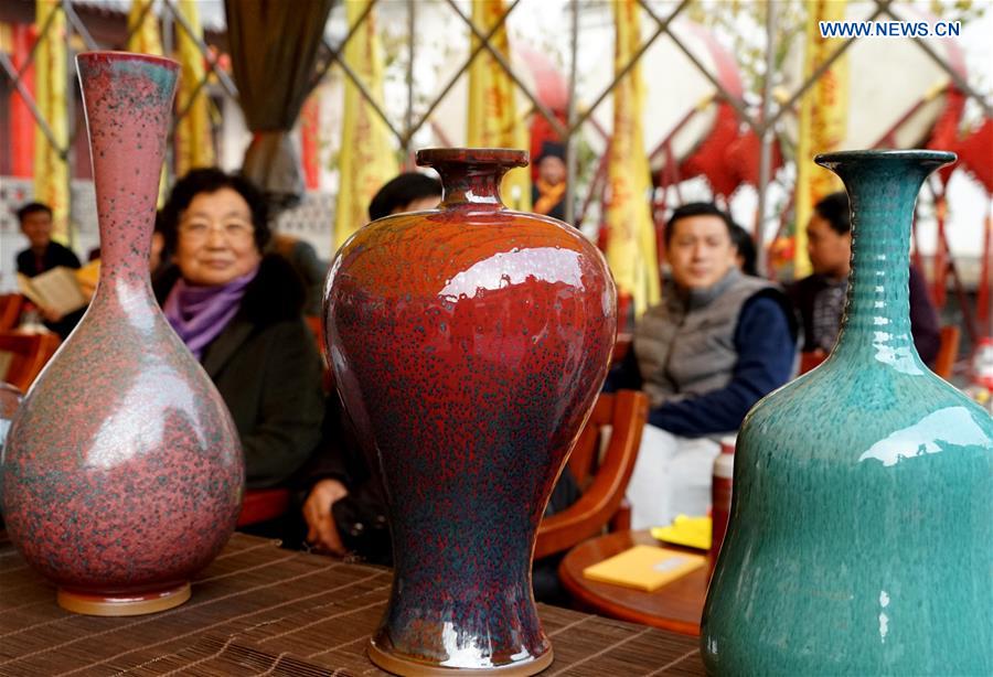 Ceremony taking porcelains out of kiln held in central China