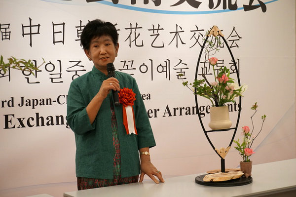 China, Japan and South Korea artists arrange flowers in summer