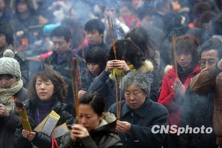 Burn joss sticks of good luck to mark the Lantern Festival