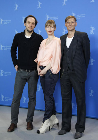 Director Schomburg poses with cast members during photocall at Berlin Film Festival