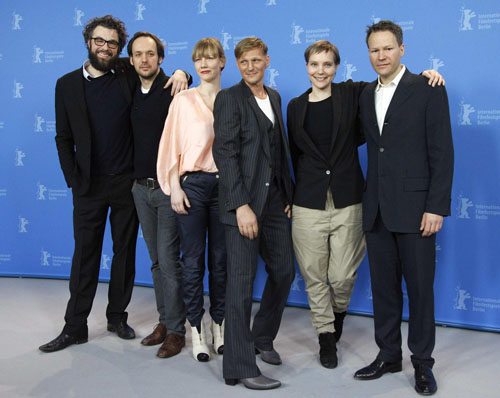 Director Schomburg poses with cast members during photocall at Berlin Film Festival