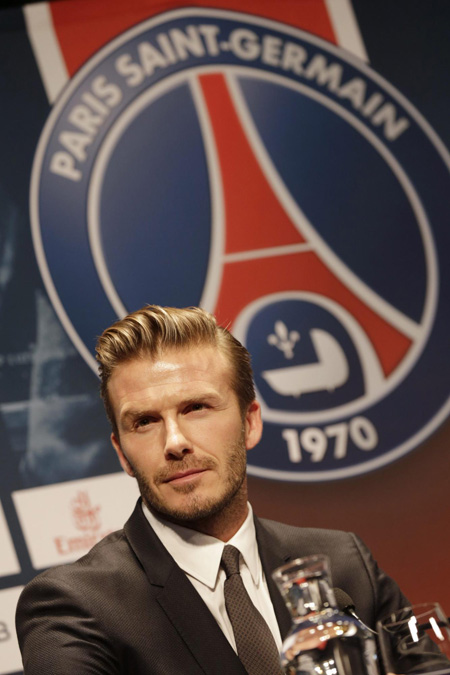 David Beckham arrives for a news conference in Paris