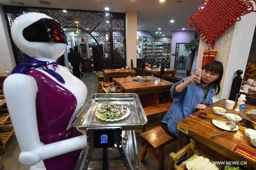 Robot waiter serves customers in Xuchang