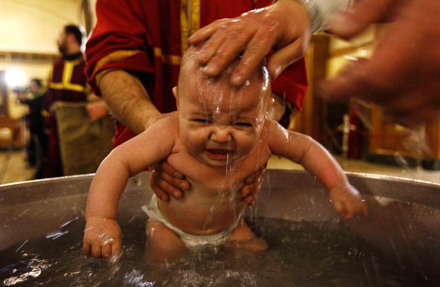 Babies baptised during a mass ceremony