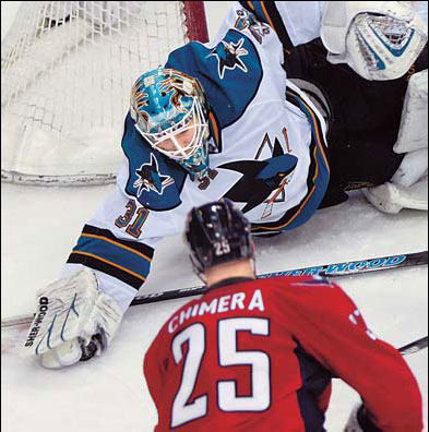 Couture sets record; Sharks beat Capitals 2-0