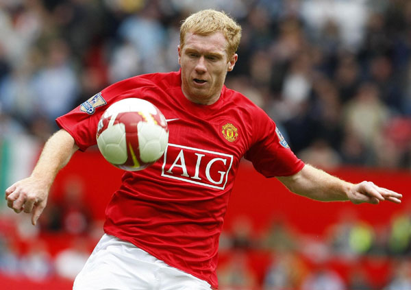 Man U midfielder Scholes hangs up boots