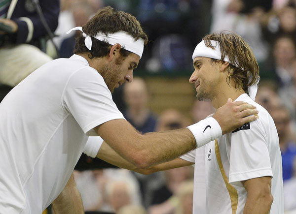 Ferrer carries Spanish flag in Nadal's absence