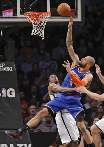 Sizzling Melo lifts Knicks over Nets, 100-97