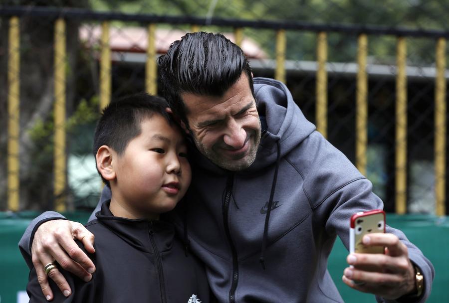 Figo charms soccer fans in Guangzhou