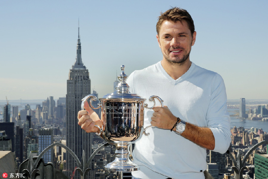 Wawrinka climbs 'top of the rock' for celebration