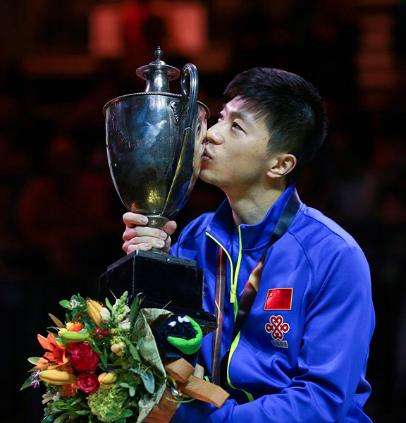 Ma Long retains men's in thrilling final