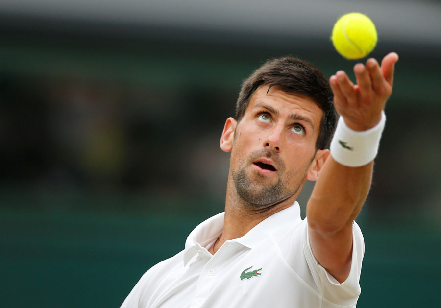 Djokovic hits out over delay after booking place in quarters
