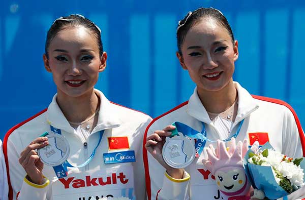 China's synchronized swimming sisters return to claim silver