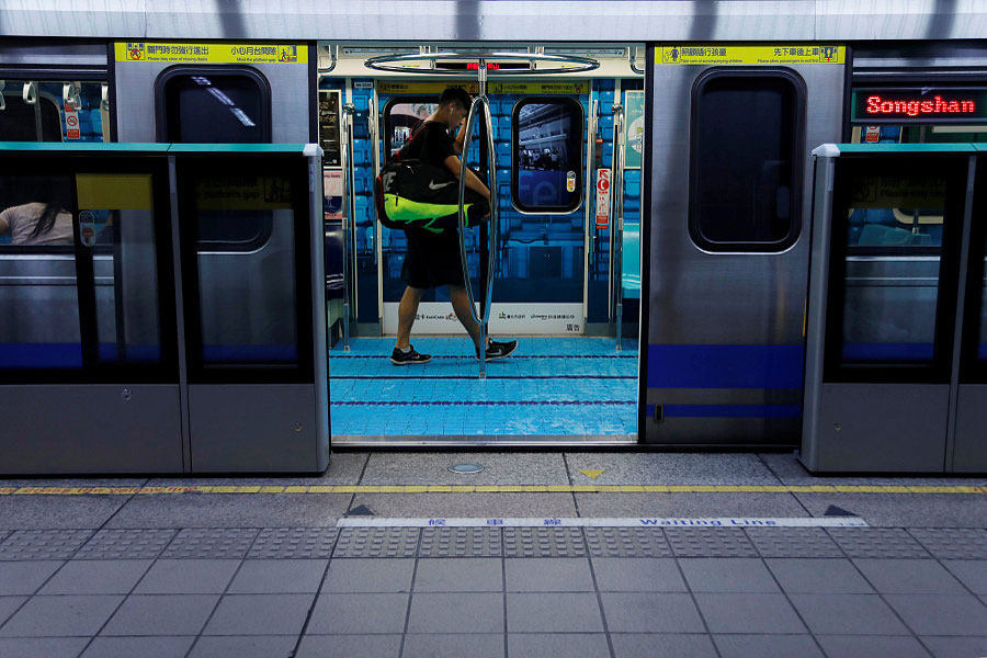 Commuters go for a swim on sports-themed trains in Taipei