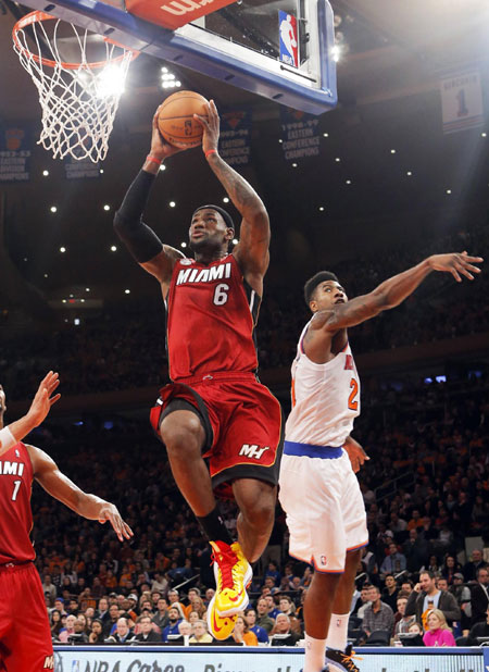 Heat beat Knicks, win 14th straight