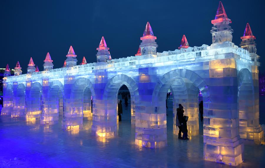 Night view of sculptures at snow expo in NE China