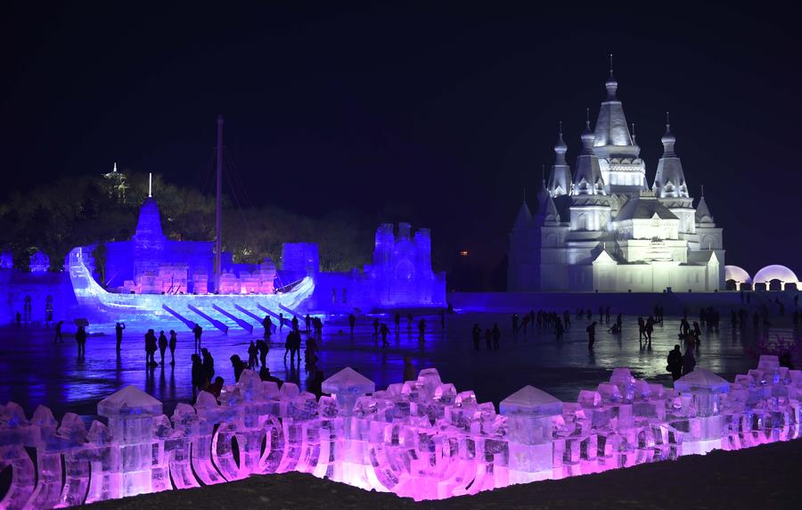 Night view of sculptures at snow expo in NE China