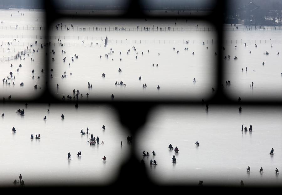 People skate on frozen Kunming Lake of Summer Palace