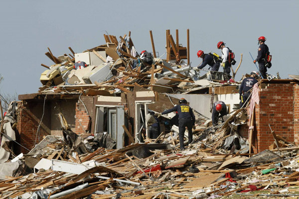 A race to find survivors before more storms in US