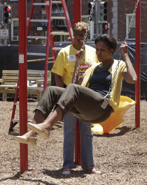 US first lady joins volunteers to build playground