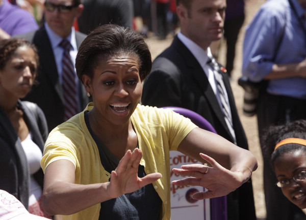 US first lady joins volunteers to build playground