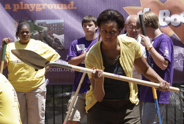 US first lady joins volunteers to build playground