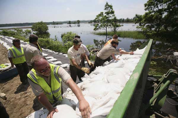 Flood surges over levees in Missouri