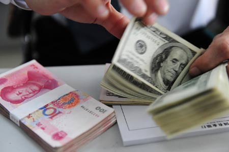 Yuan hits new high against greenback