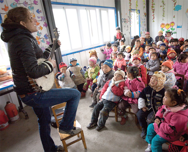 Learning to warm up to and love China, with a claw-hammer banjo on her knee