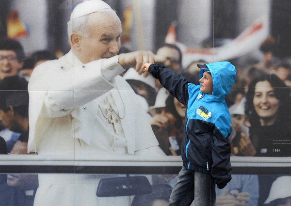 Pope beatifies John Paul before 1m faithful