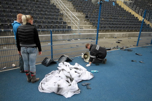 Polish hooligans undress player after match